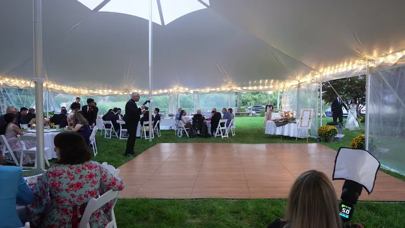 A tented wedding reception dance floor set up by DJ Ajay Ramos